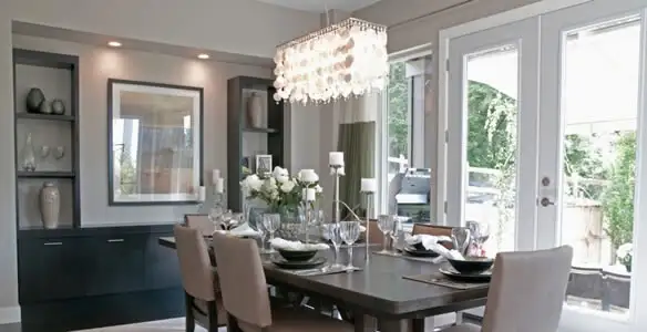 Elegant dining room chandelier installation above table in Memphis, TN