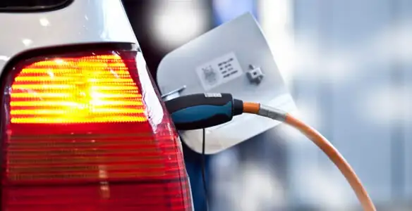 Electric car plugged into EV charger after professional installation in Memphis, TN
