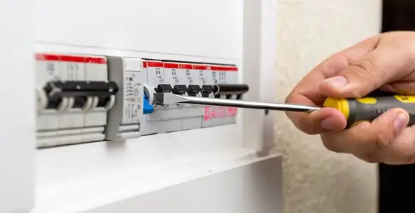 electrical panel upgrade service showing technician adjusting circuit breakers during system upgrade in Memphis, TN