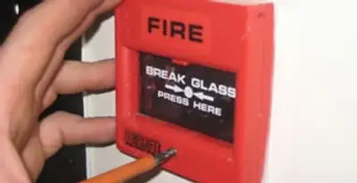 fire alarm installation service showing manual fire alarm pull station installed by licensed electricians in Memphis, TN