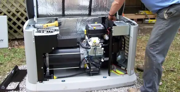 generator installation service showing technician connecting and configuring generator components in Memphis, TN