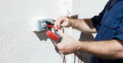 Electrician performing home electrical outlet and wiring inspection in Memphis, TN
