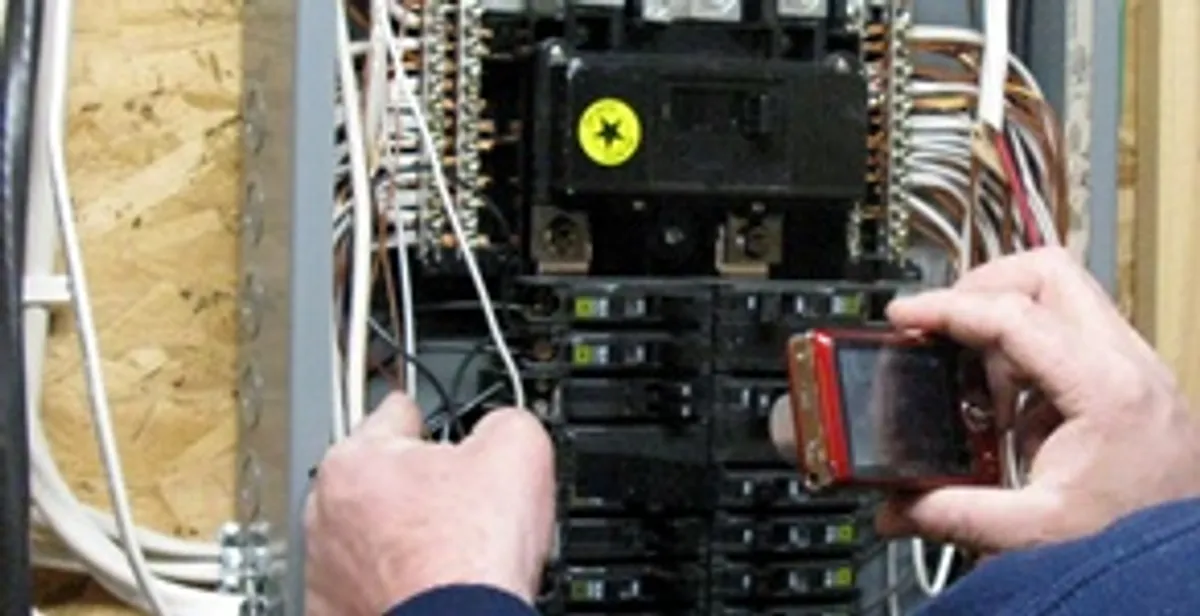 Home electrical inspection of circuit breaker panel by licensed electrician in Memphis, TN