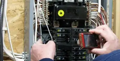 Home electrical inspection of circuit breaker panel by licensed electrician in Memphis, TN
