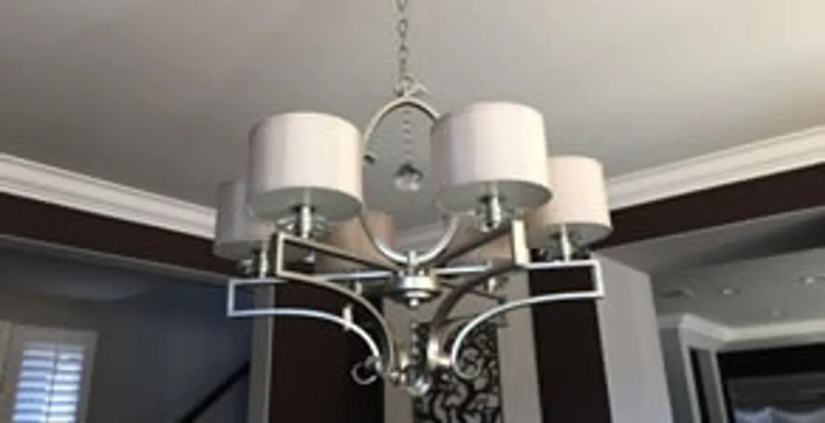 Modern chandelier installation with multiple light fixtures in Memphis, TN