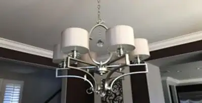 Modern chandelier installation with multiple light fixtures in Memphis, TN