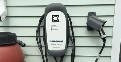 Outdoor electric vehicle charger installation on residential wall in Memphis, TN
