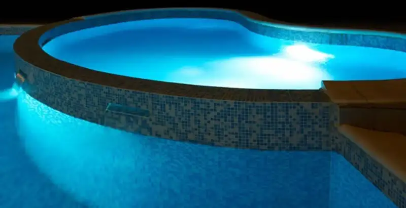 pool light installation and repair services highlighting illuminated pool interior lighting in Memphis, TN
