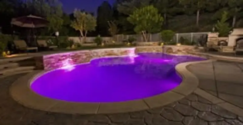 pool light installation and repair services illuminating a residential swimming pool in Memphis, TN