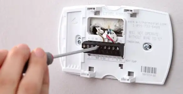 Thermostat installation service with proper wiring and secure wall mounting in Memphis, TN
