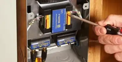 Whole home surge protection device being installed by a licensed electrician to protect electrical systems in Memphis, TN